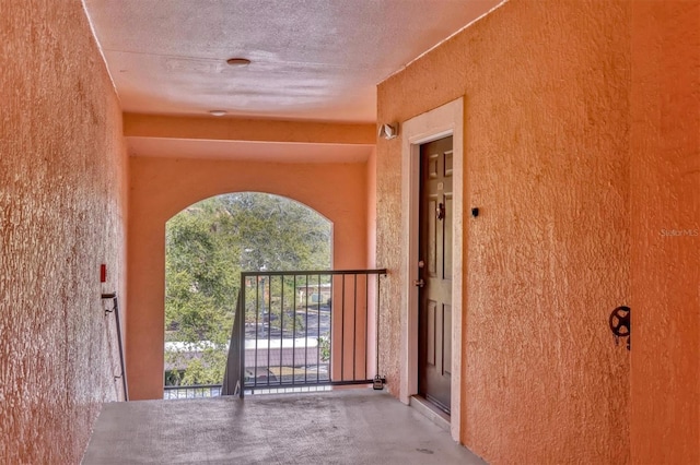 entrance to property with stucco siding