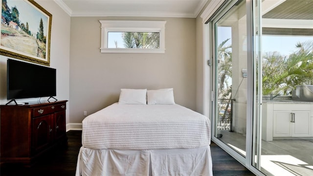 bedroom featuring access to outside, wood finished floors, baseboards, and ornamental molding