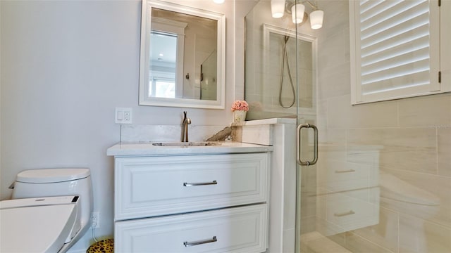 full bathroom featuring vanity, toilet, and a stall shower