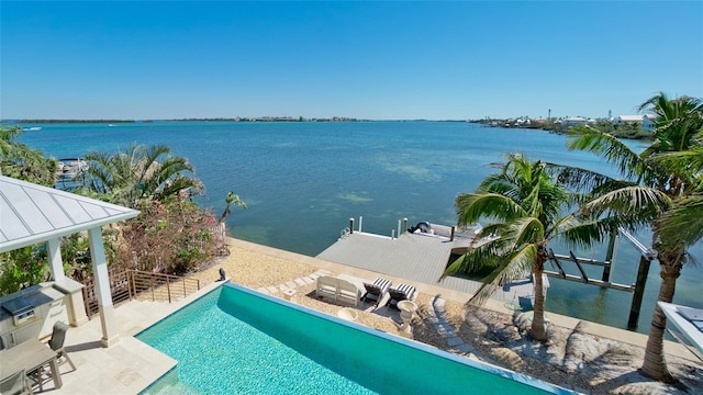 exterior space featuring a patio area and a water view