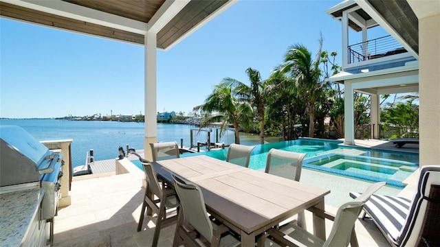 view of patio / terrace with a water view, an infinity pool, a grill, outdoor dining area, and an in ground hot tub