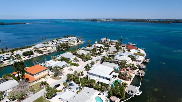 birds eye view of property featuring a residential view and a water view