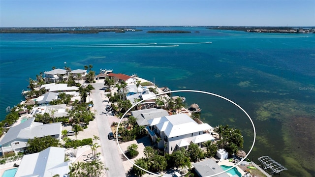 birds eye view of property with a water view and a residential view