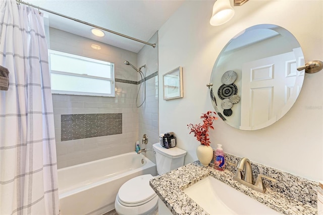 full bathroom with vanity, toilet, and shower / tub combo with curtain