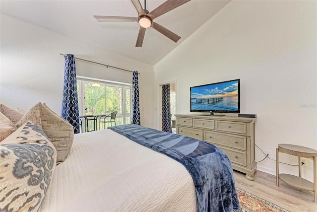 bedroom with high vaulted ceiling, light wood-style flooring, access to exterior, baseboards, and ceiling fan