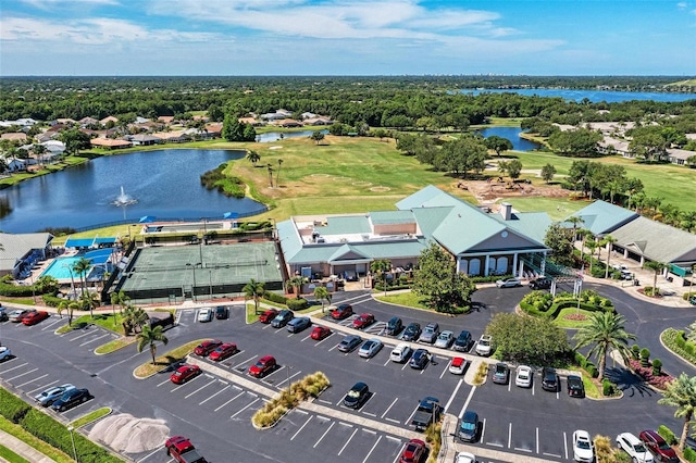 bird's eye view featuring a water view and golf course view