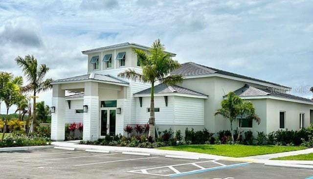 view of front of property featuring uncovered parking