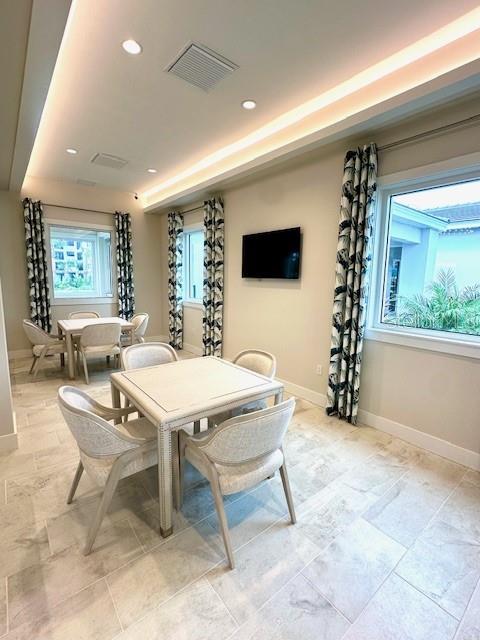 dining room featuring baseboards, visible vents, and recessed lighting