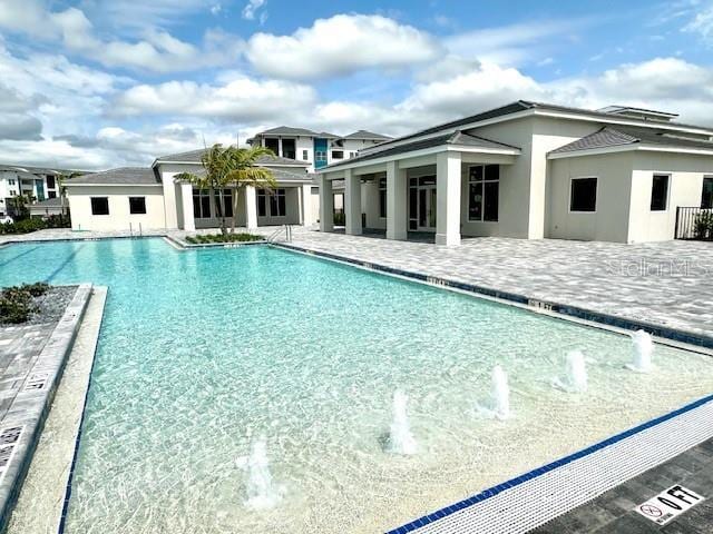 community pool with a patio