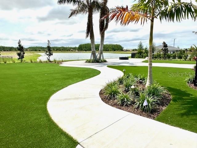 surrounding community featuring a yard