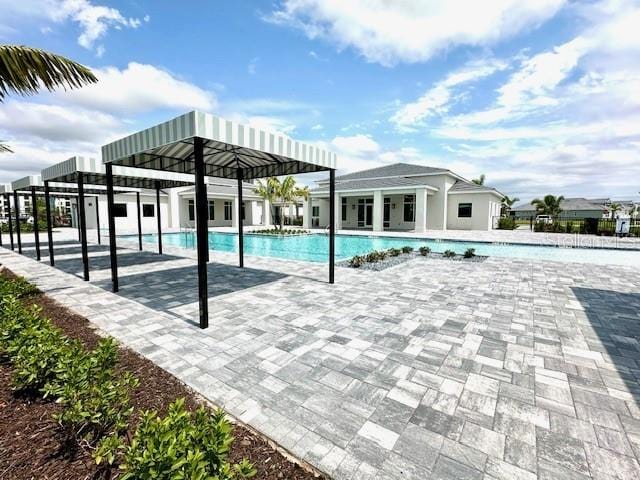 pool with a patio area
