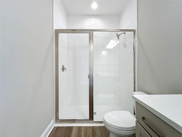 10006 Degas Ter, Bradenton, FL 34212 - full bathroom with a stall shower, toilet, wood finished floors, and vanity