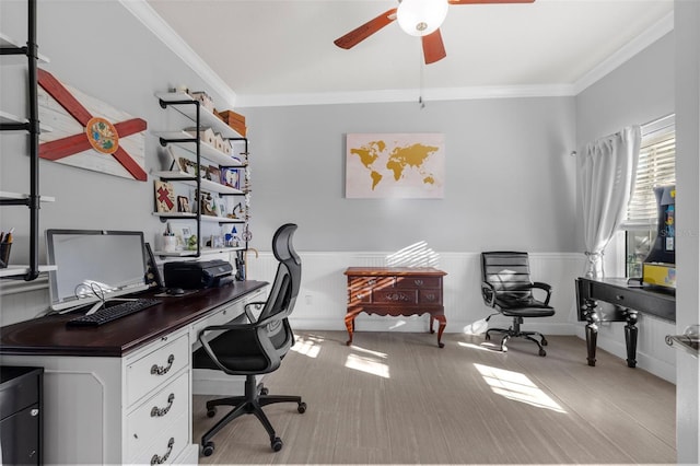 office featuring wainscoting, a ceiling fan, and ornamental molding