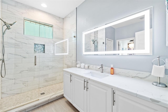 full bathroom featuring vanity and a stall shower