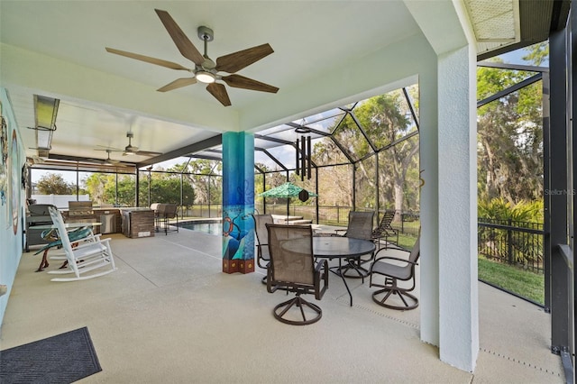 view of patio / terrace featuring a lanai, outdoor dining area, a fenced in pool, and ceiling fan