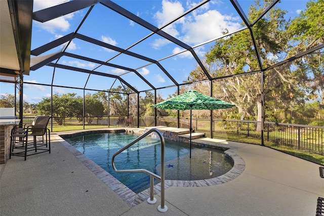 view of swimming pool with outdoor dry bar, a lanai, and a patio