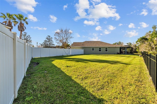 view of yard with a fenced backyard