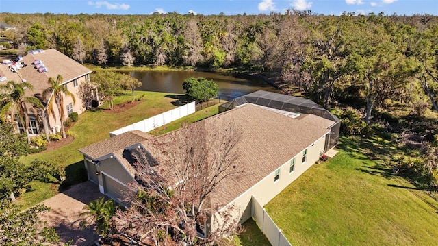 bird's eye view featuring a view of trees and a water view