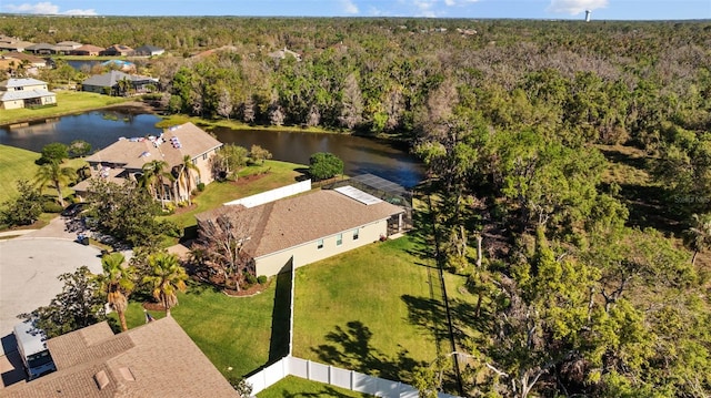 aerial view featuring a forest view and a water view