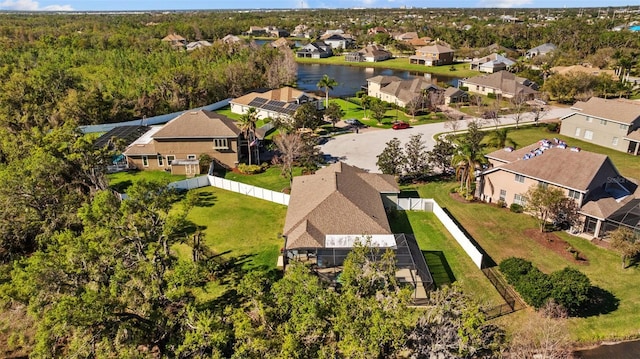 birds eye view of property with a residential view and a water view