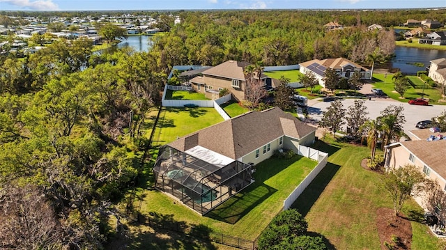 bird's eye view with a residential view, a water view, and a view of trees