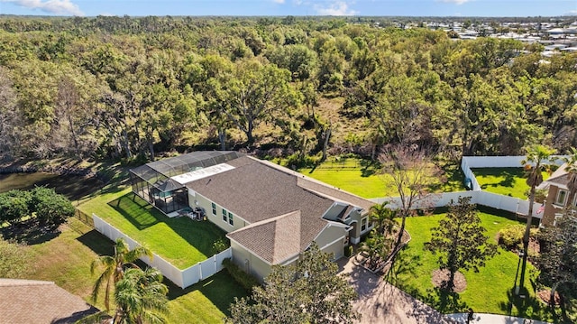 aerial view featuring a wooded view