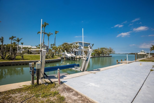 view of dock with a water view and boat lift