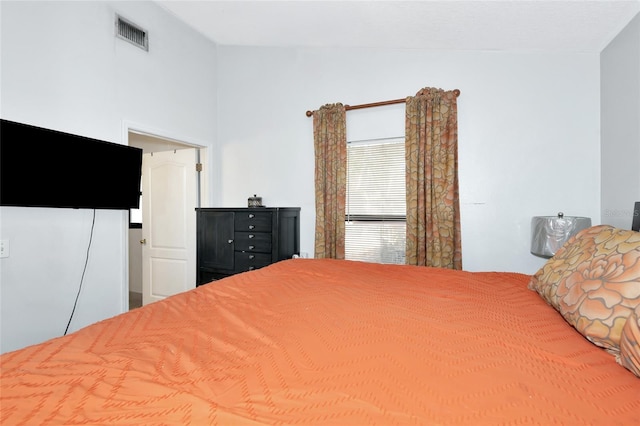 bedroom featuring visible vents