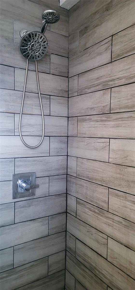 full bathroom with tiled shower