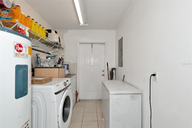 laundry room with light tile patterned floors, laundry area, electric panel, electric water heater, and washing machine and dryer