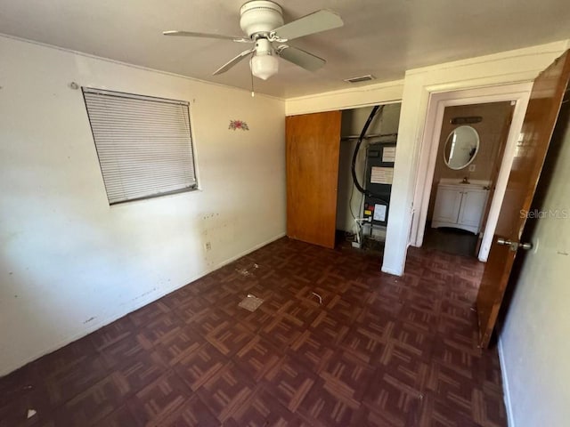 unfurnished room featuring ceiling fan