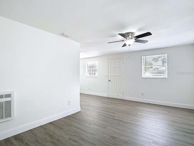 3512 N 10th St, Tampa, FL 33605 - empty room featuring visible vents, baseboards, wood finished floors, and ceiling fan