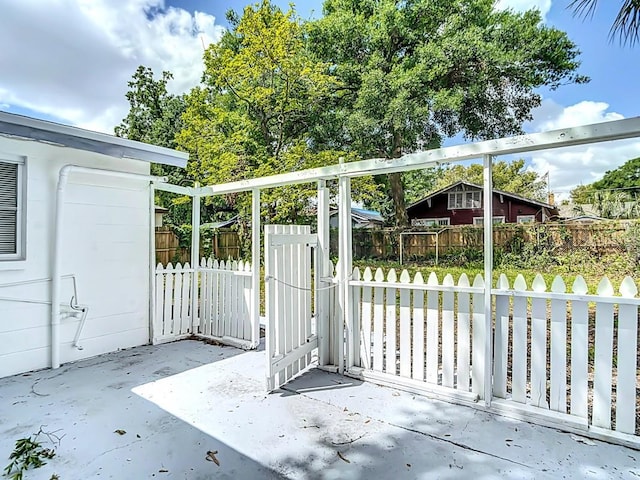 3512 N 10th St, Tampa, FL 33605 - view of gate featuring a patio area and fence
