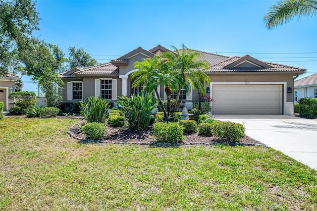 view of front facade featuring an attached garage, a tile roof, a front yard, stucco siding, and driveway