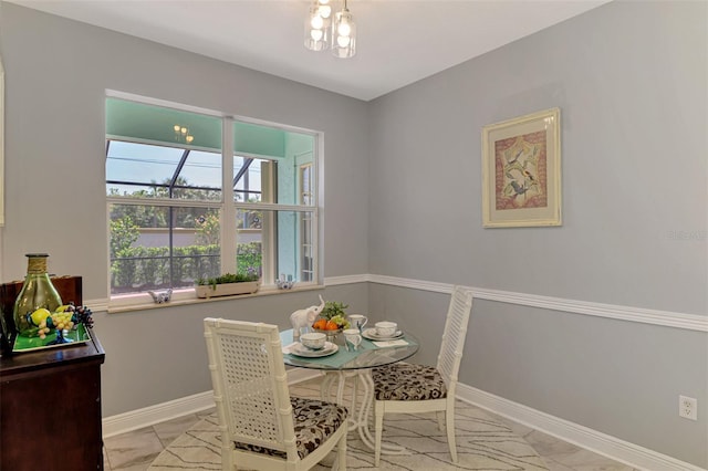 dining space featuring baseboards