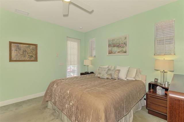 bedroom featuring light carpet, visible vents, ceiling fan, and baseboards