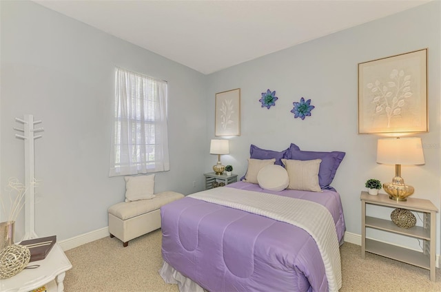 bedroom with carpet and baseboards