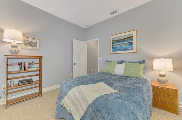 bedroom featuring visible vents, baseboards, and carpet