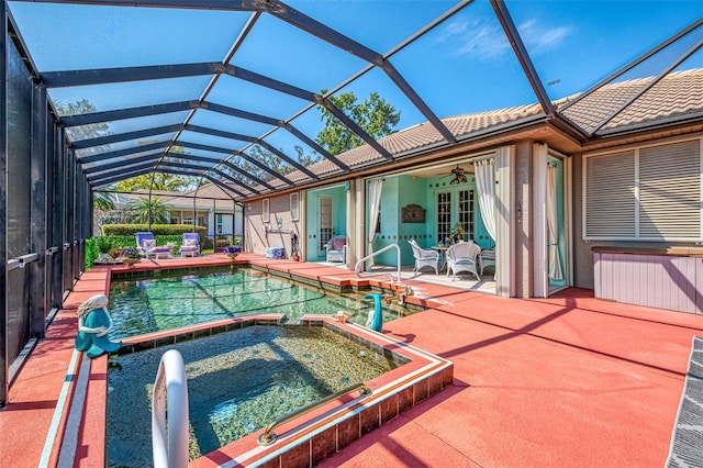 107 Wayforest Dr, Venice, FL 34292 - view of pool with glass enclosure, a patio, a pool with connected hot tub, ceiling fan, and french doors