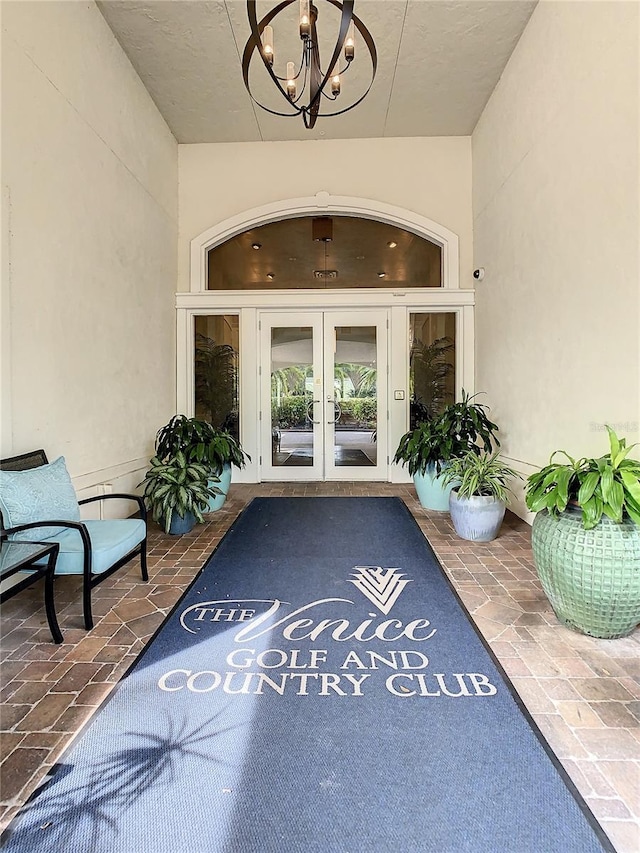 107 Wayforest Dr, Venice, FL 34292 - property entrance with a patio area, french doors, and stucco siding