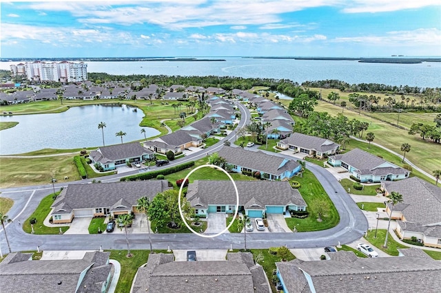 aerial view with a residential view and a water view