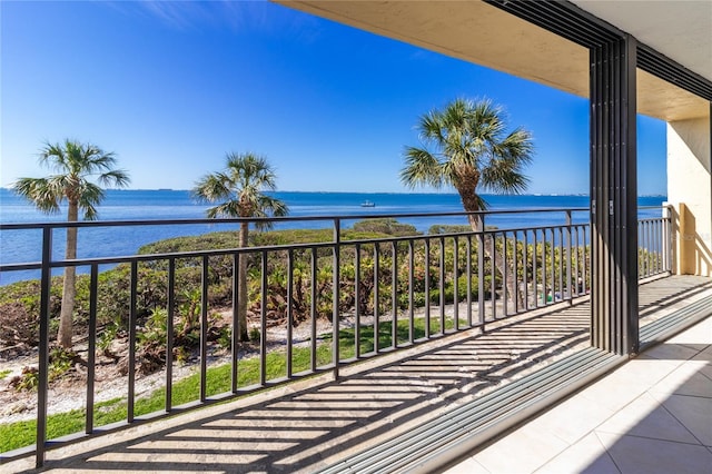 balcony featuring a water view