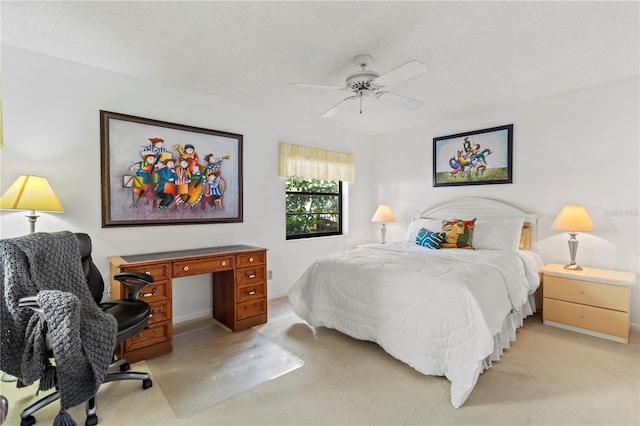 bedroom featuring light carpet and ceiling fan