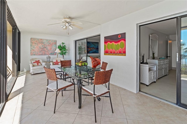 dining area featuring light tile patterned flooring and ceiling fan