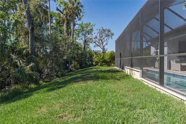 5621 Badini Way, Palmetto, FL 34221 - view of grassy yard featuring an outdoor pool and a lanai