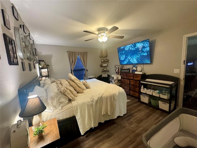 bedroom with wood finished floors and a ceiling fan