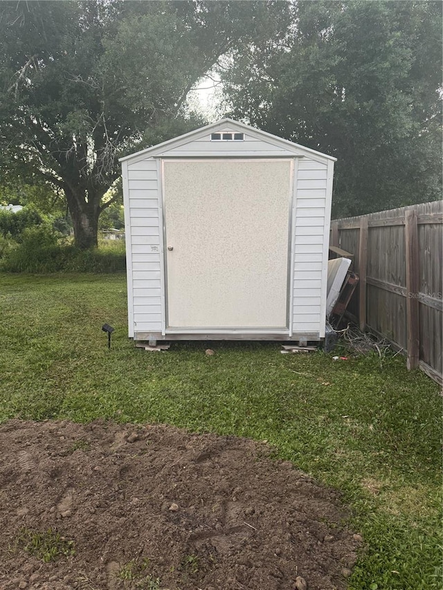 view of shed with fence