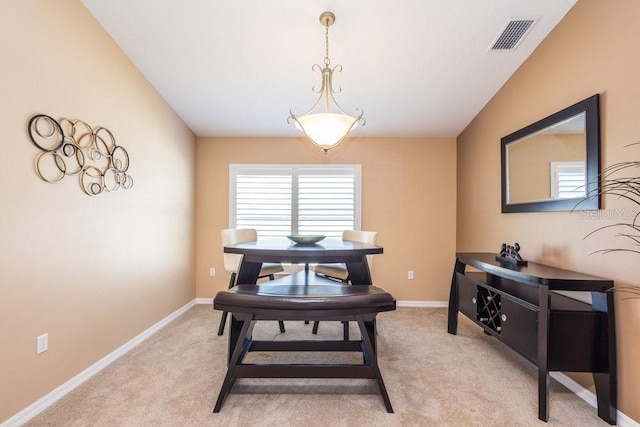 dining space with visible vents, light carpet, and baseboards