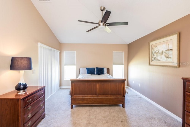 bedroom with visible vents, ceiling fan, baseboards, light colored carpet, and vaulted ceiling