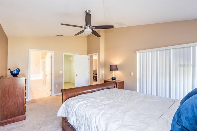 carpeted bedroom featuring baseboards, visible vents, ceiling fan, vaulted ceiling, and connected bathroom